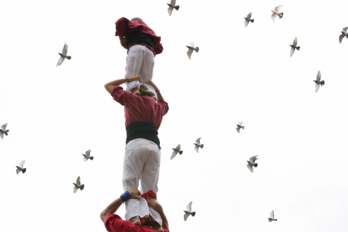 Castellers: a group of people, that build human castles at traditional festivities. Catalonia (Spain).