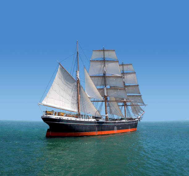 Tall ship captured in black and white sailing out of Boston Harbor