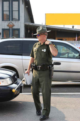 State trooper walking in street
