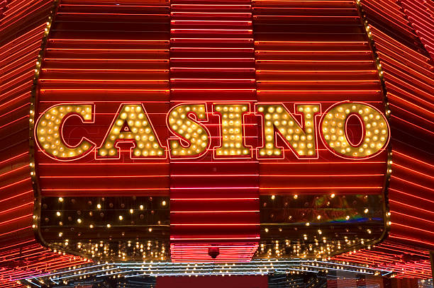 Bright yellow Las Vegas neon lights spelling CASINO Lights outside a casino, Las Vegas Nevada. the strip stock pictures, royalty-free photos & images