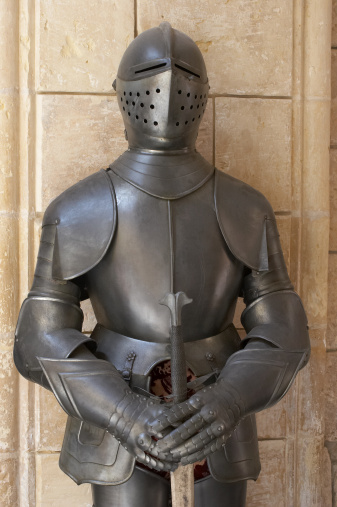photography of a medieval knight in dark armor, holding an axe and a mace