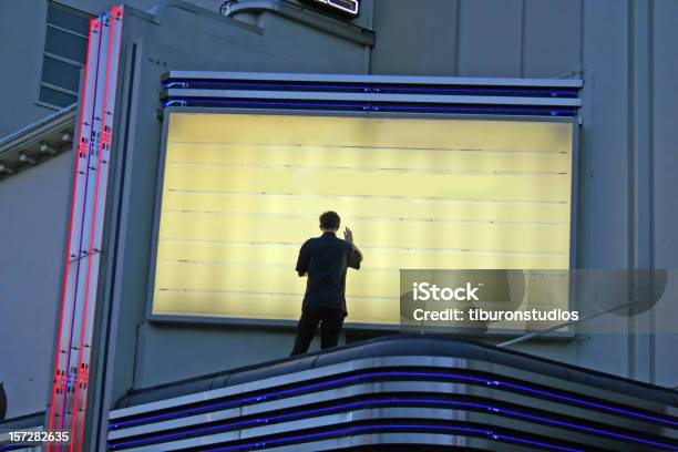 Now Showing Man Changing Sign Stock Photo - Download Image Now - Theater Marquee, Stage Theater, Theatrical Performance