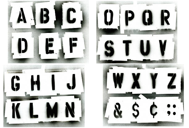 Black spray painted stencil alphabet set Full alphabet stencil set.  Sprayed with black spray paint on white background.  Great for grunge designs, paint is runny spotted. typescript photos stock pictures, royalty-free photos & images