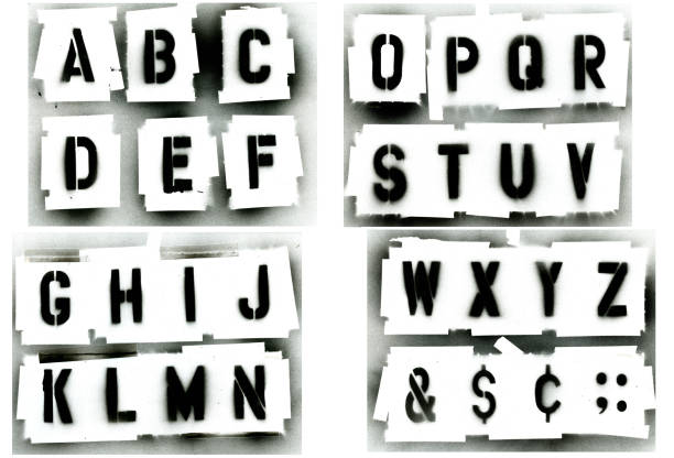 Black spray painted stencil alphabet set Full alphabet stencil set.  Sprayed with black spray paint on white background.  Great for grunge designs, paint is runny spotted. stencil stock pictures, royalty-free photos & images