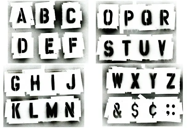 Full alphabet stencil set.  Sprayed with black spray paint on white background.  Great for grunge designs, paint is runny spotted.