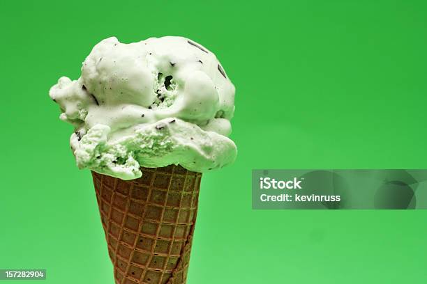 Mint Ice Cream Cone On Green Background Stock Photo - Download Image Now - Mint Ice Cream, Ice Cream Cone, Ice Cream