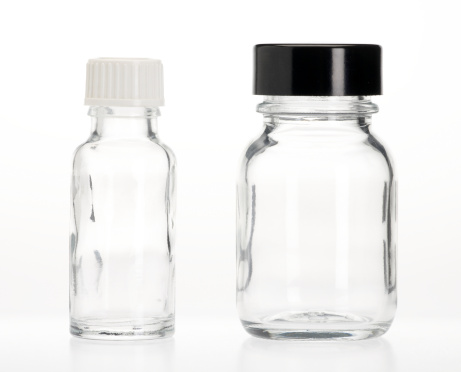 Two empty capsule bottles