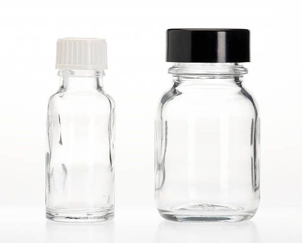 Two empty capsule bottles Two empty capsule bottles bottle empty nobody glass stock pictures, royalty-free photos & images