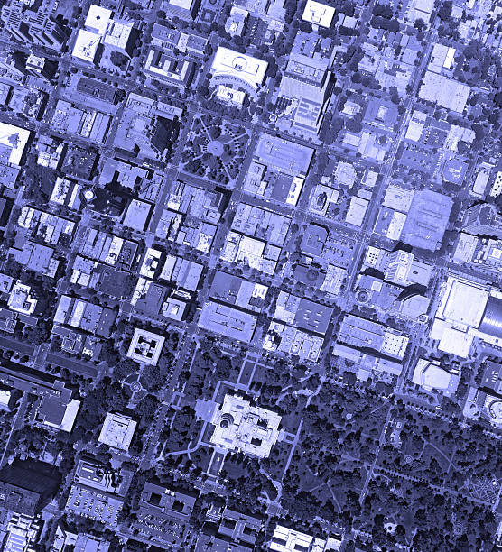 A blue filter stylized aerial view of a downtown, in a medium size city.