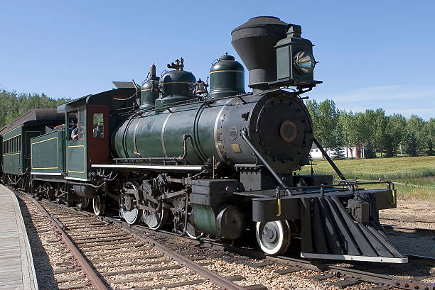 Close-up of a steam-powered train on its tracks stock photo