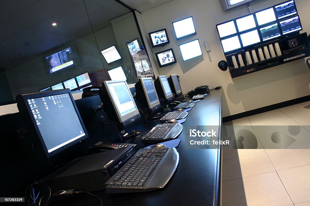 Operations Room A row of terminals and monitors in an Operations Data Centre. Cross Section Stock Photo