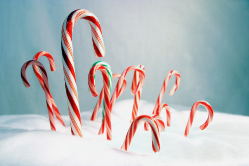 Set with yummy sweet Christmas candy canes on white background