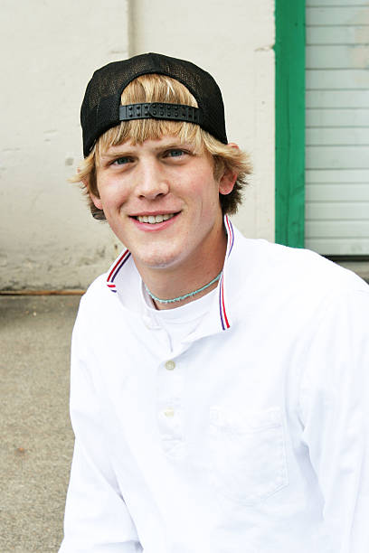 Young Man with Backwards Trucker Hat  back to front stock pictures, royalty-free photos & images