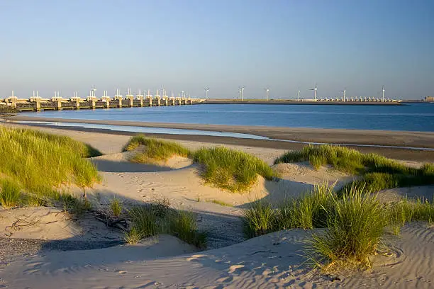 Dutch Oosterscheldedam. This is a waterwork that can be opened or closed. It is only closed during heavy storms at high tide. It is part of the dutch deltaworks. The largest watermanagement project in the world.....