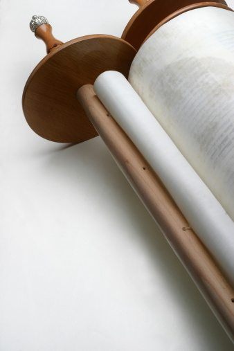 Closed Torah scroll on a white background (not isolated). 