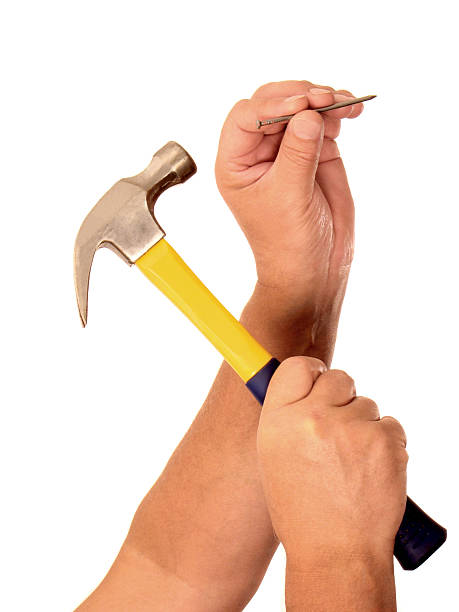 Man Hammering Nail Into Wall Stock Photos, Pictures & Royalty-Free Images - iStock Man Hammering Nail Into Wall Stock Photos, Pictures & Royalty-Free Images - iStock