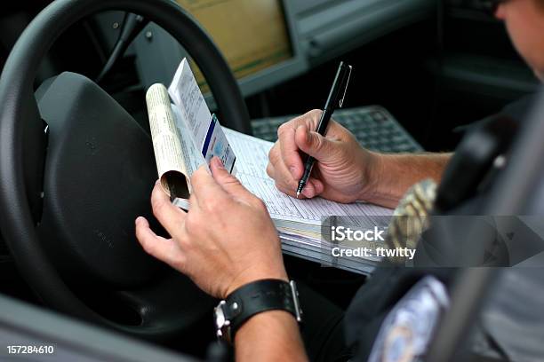 Police Officer Writing Ticket 2 Stock Photo - Download Image Now - Police Force, Speeding Ticket, Ticket