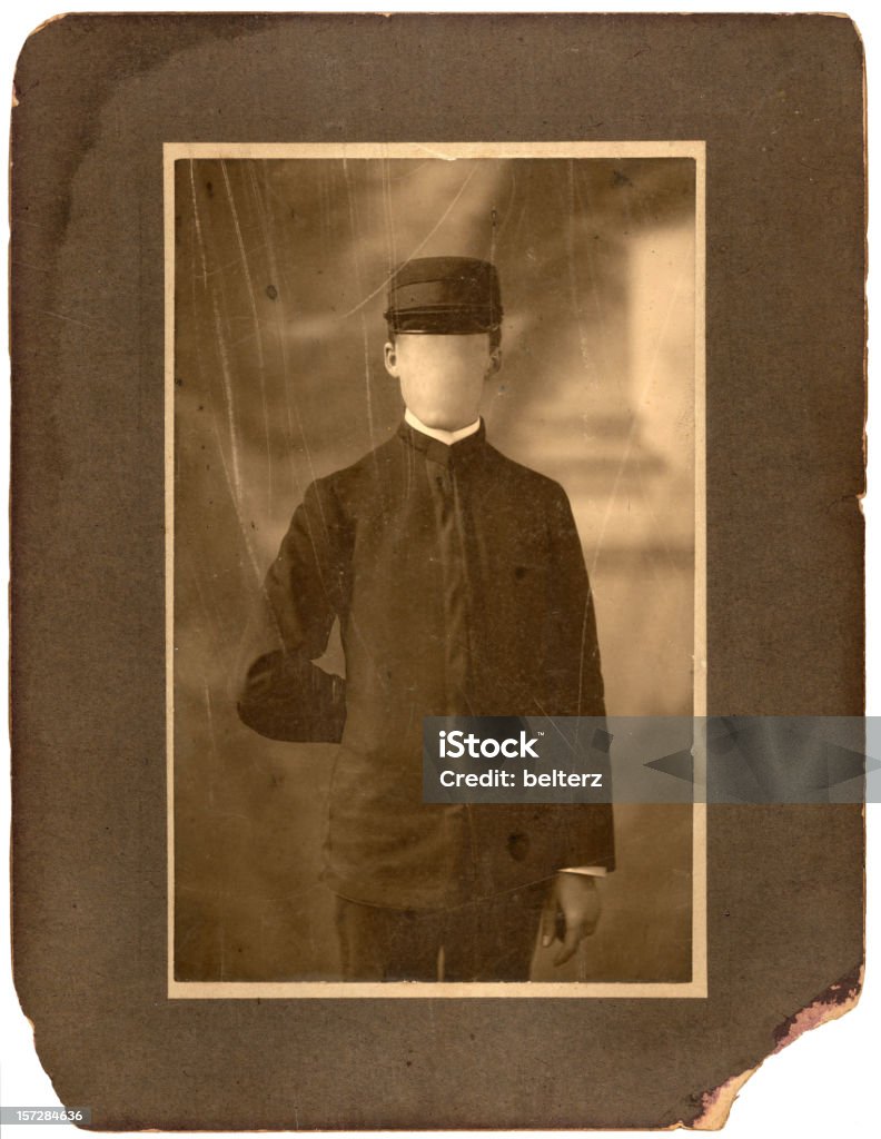 vintage faceless man a vintage photograph and frame showing wear and tear with face blanked out Old-fashioned Stock Photo