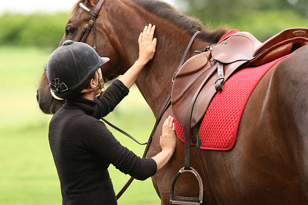 istock Girl getting ready for horseback riding, Norway 157285959