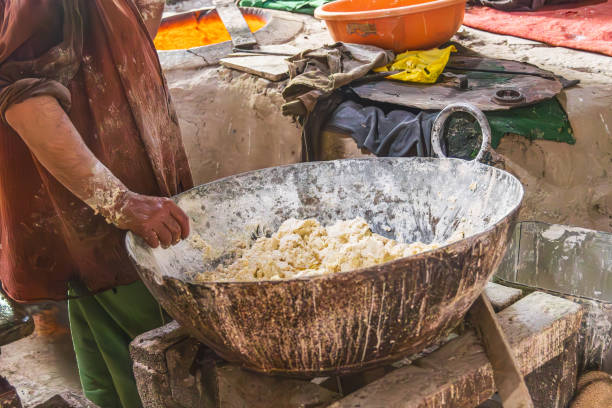 istock Baker mixing dough in Jammu and Kashmir. 1572861491