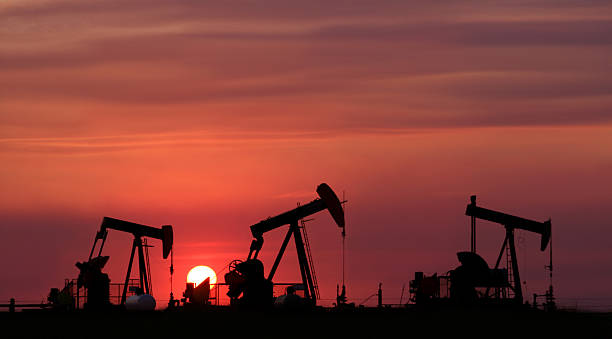 Three Pumpjacks  oil pump oil industry alberta equipment stock pictures, royalty-free photos & images