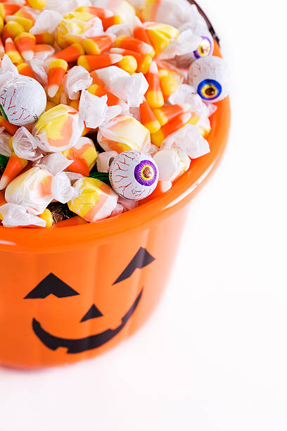 istock Bucket of Halloween Candy on White, Copy Space 157286320