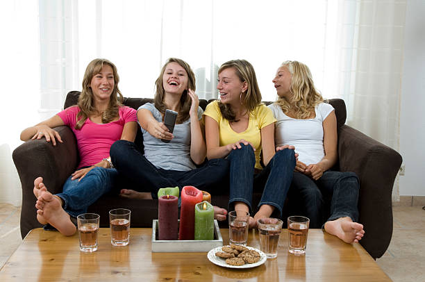 istock happy girls watching television 157286349