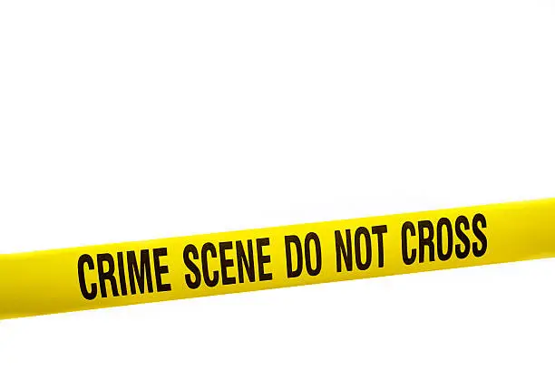 Yellow crime scene tape against a white background.  A clipping path is included so this tape can easily be inserted over other images to create an instant "Crime Scene".