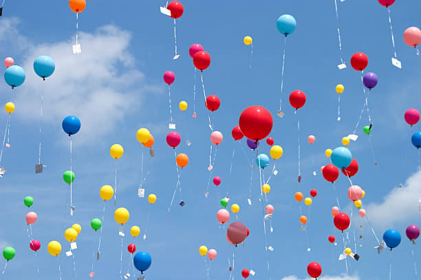 flying balloons stock photo