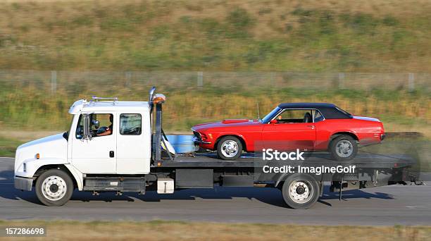Tow Truck Hauling A New Red Car Stock Photo - Download Image Now - Tow Truck, Car, Towing