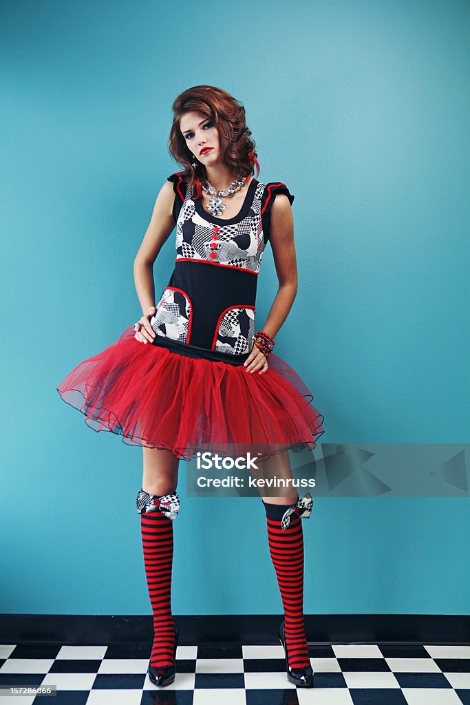 Woman in Red Dress and Stockings on Blue Wall  Adult Stock Photo