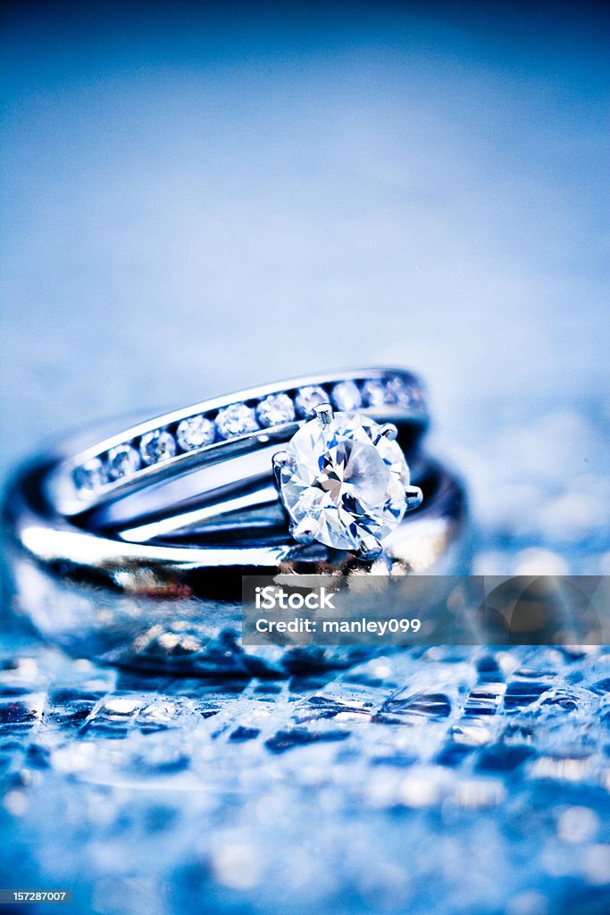 platinum rings on shattered glass (ice blue)  Jewelry Stock Photo