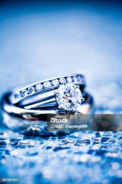 Platinum Rings On Shattered Glass Stock Photo - Download Image Now - Jewelry, Broken, Diamond - Gemstone