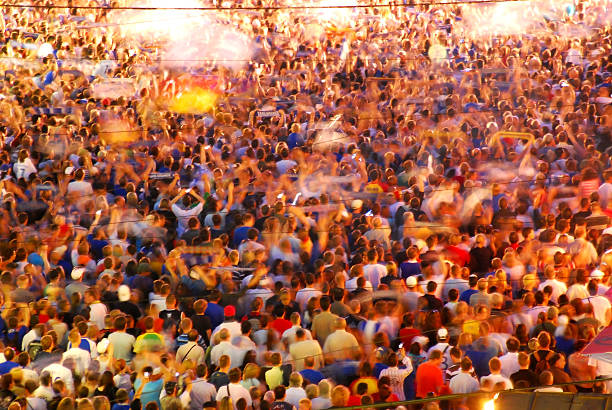 istock crowd of people in blurred light 157287274