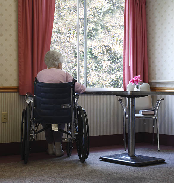 Elderly woman in nursing home stock photo