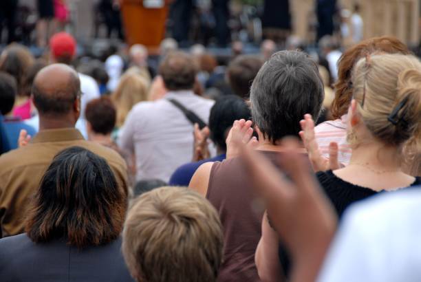 istock Applauding enthusiastic crowd at a public event 157287519