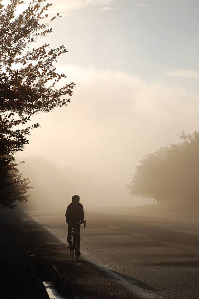 istock Cyclist in a foggy morning 157287665