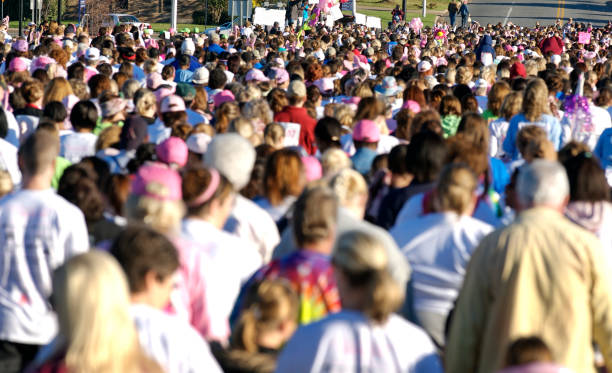 Crowd at Race for the Cure walking for a cause stock pictures, royalty-free photos & images