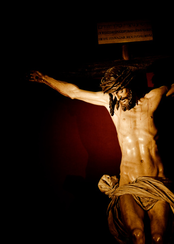 The figure of Christ Crucified in Cristo de la Clemencia as sculpted by Juan Martinez Montanes in 1603 and is done in wood, gessoed, polychromed and gilded