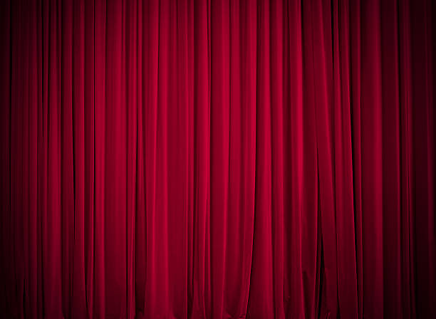 Red stage curtain Red stage curtain in spotlight. Add your copy on it - lot of space.  velvet curtain stock pictures, royalty-free photos & images