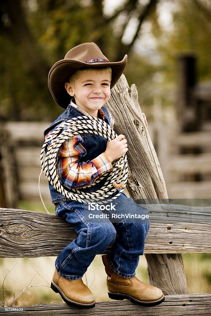 Happy Rancher A young boy enjoys life on the farm. Child Stock Photo