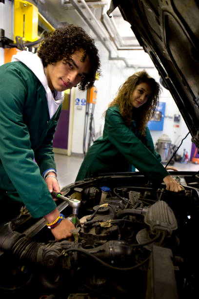istock teenage students gaining practical experience studying engines in a garage 157288688