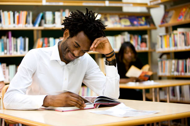 istock adult education: university student reading in his college library 157288838