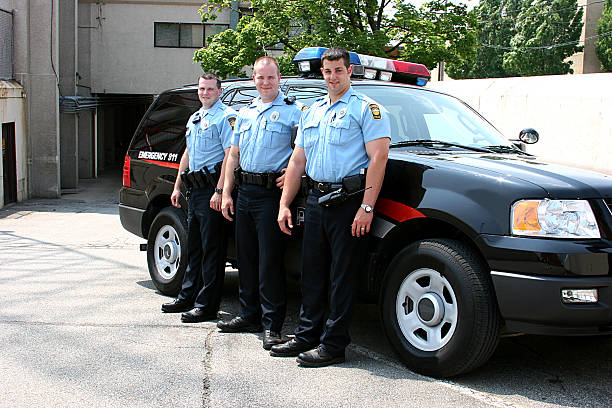 Police Officers Full Body Smiling stock photo
