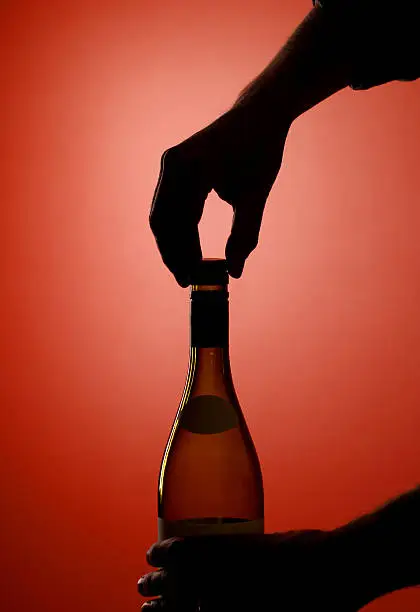 Opening a bottle of wine with a screw top closure