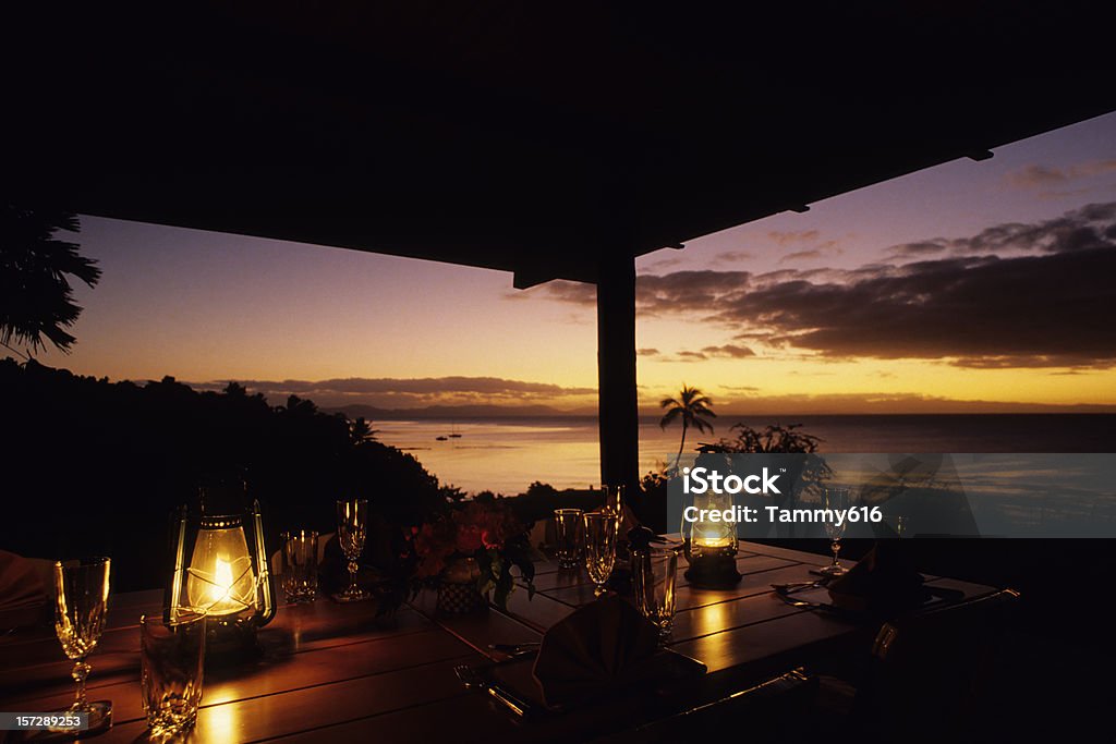 Tropical Dining Dinner table at hilltop South Pacific  resort. Restaurant Stock Photo