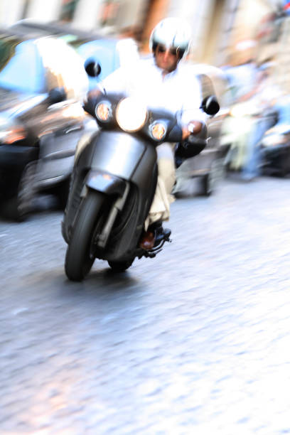 istock Roman scooter with motion blur, Rome Italy 157289420