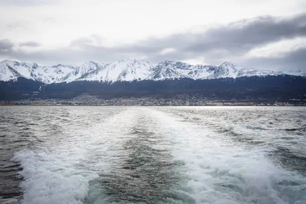 VIEW OF THE CITY OF USHUAIA. BTE NAVIGATING THE COAST OF USHUAIA. TIERRA DEL FUEGO, ARGENTINE PATAGONIA