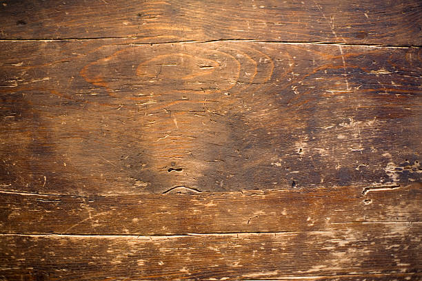 Close up photo of a distressed wood table