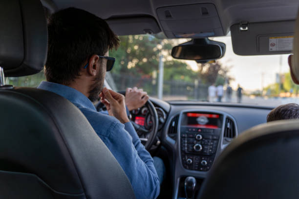 istock Male model driving a car. 1572895903